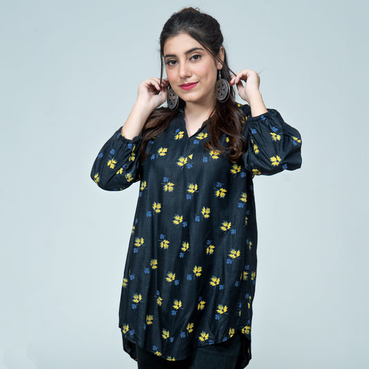 Black tunic top with yellow and blue leaf print