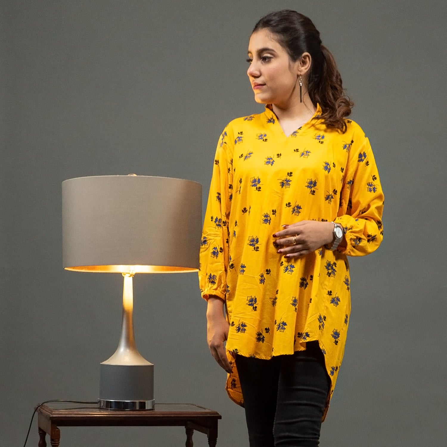 Mustard yellow tunic top with blue and black leaf print